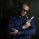 Brutal man with a gun Caucasian appearance