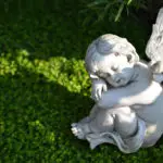 Little angel figurine on the grave