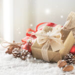 Christmas presents or gifts with elegant bow and christmas decor